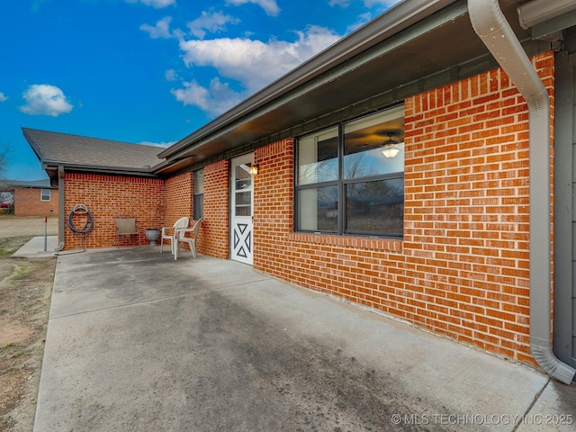 view of side of property featuring a patio area