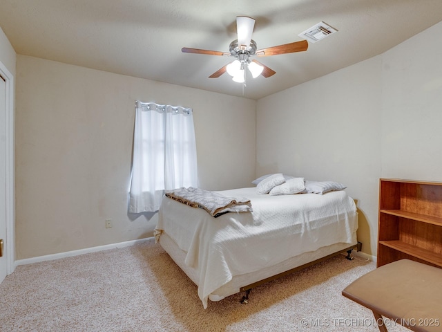 bedroom with light carpet and ceiling fan