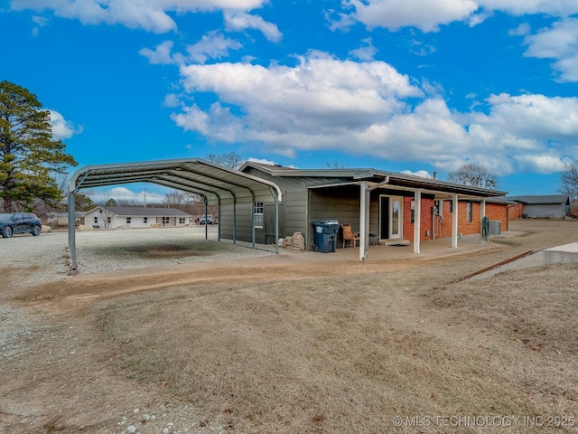 exterior space with a carport