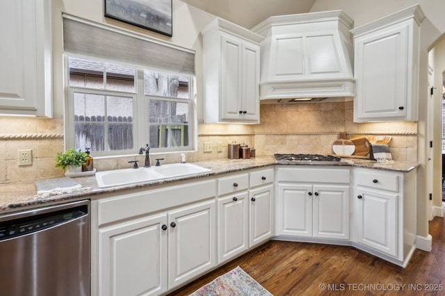 kitchen with white cabinetry, stainless steel appliances, and sink