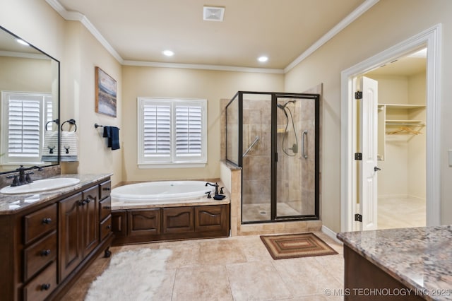 bathroom featuring vanity, crown molding, a wealth of natural light, and independent shower and bath