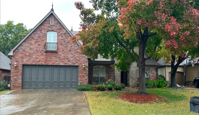 view of front of home with a garage and a front yard