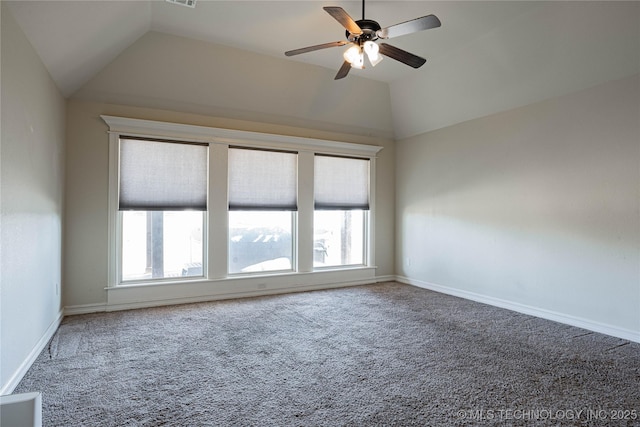 empty room with lofted ceiling, plenty of natural light, and carpet