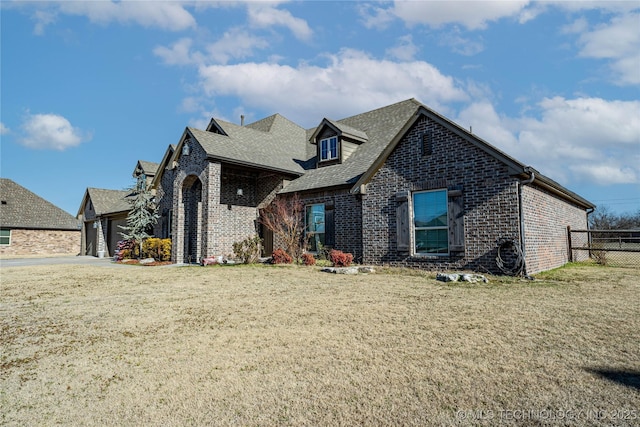 view of front of property with a garage and a front yard