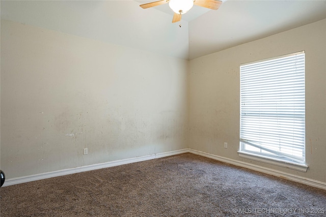 carpeted empty room with lofted ceiling and ceiling fan