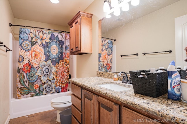 full bathroom featuring wood-type flooring, vanity, shower / bathtub combination with curtain, and toilet