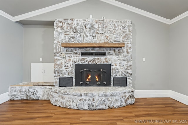 details with hardwood / wood-style floors, crown molding, and a fireplace