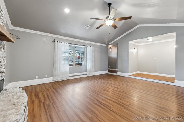 unfurnished living room with a fireplace, crown molding, vaulted ceiling, and wood-type flooring