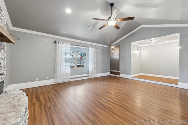 unfurnished living room with lofted ceiling, a stone fireplace, crown molding, wood-type flooring, and ceiling fan