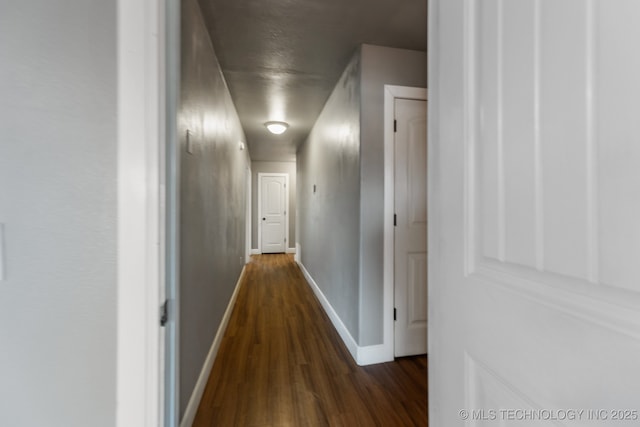 hallway featuring dark hardwood / wood-style floors