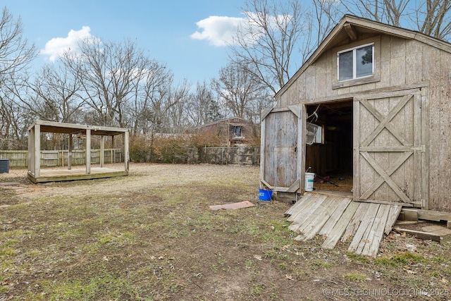 view of yard featuring cooling unit and a storage unit