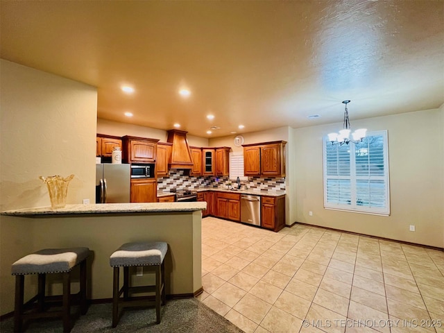 kitchen featuring custom exhaust hood, tasteful backsplash, light tile patterned floors, kitchen peninsula, and stainless steel appliances