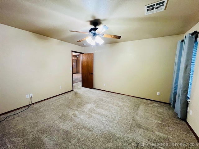 unfurnished bedroom with ceiling fan and light colored carpet