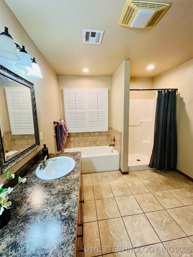 bathroom featuring tile patterned floors, separate shower and tub, and vanity