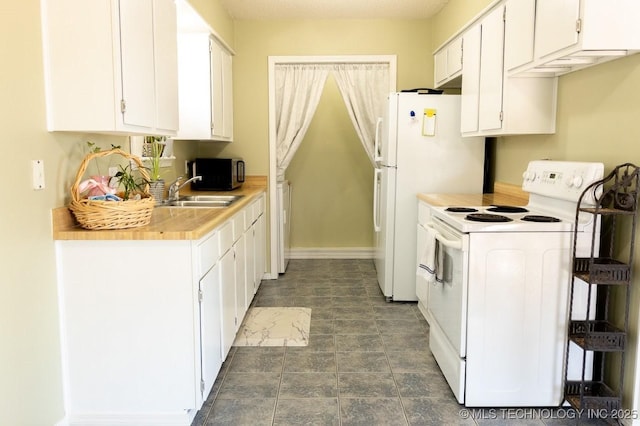 kitchen featuring white cabinetry, white appliances, and sink