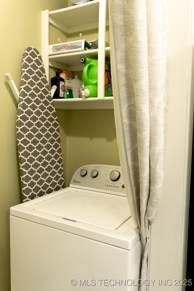 clothes washing area with washer / dryer