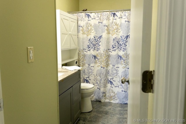 bathroom featuring vanity, toilet, and a shower with shower curtain