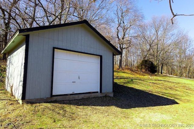 garage featuring a yard