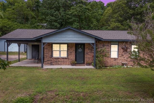 ranch-style house with a lawn