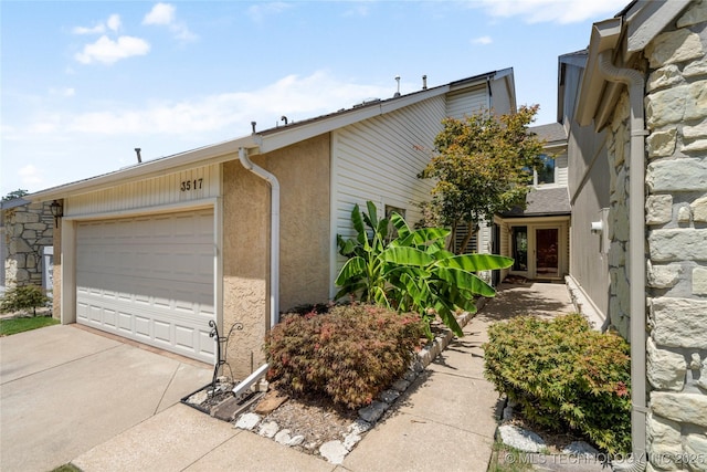 view of property exterior featuring a garage