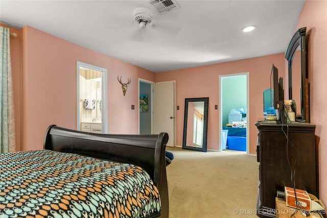 carpeted bedroom featuring connected bathroom