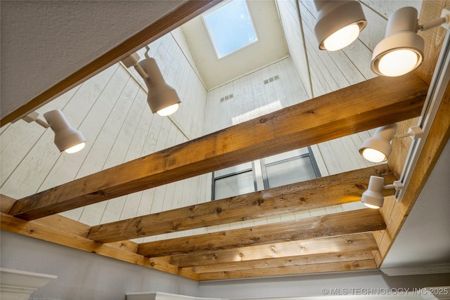 details featuring beamed ceiling