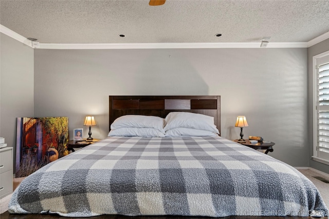 carpeted bedroom featuring multiple windows, ornamental molding, and a textured ceiling