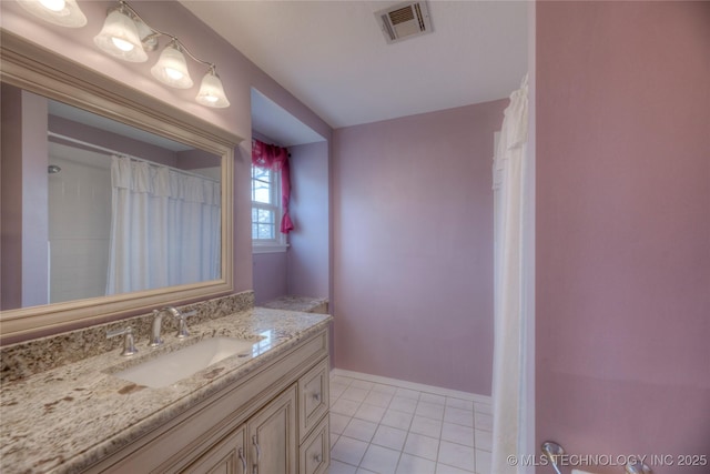 bathroom featuring vanity and tile patterned flooring