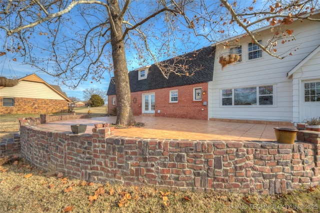 rear view of house featuring a patio