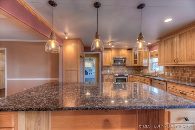 kitchen with appliances with stainless steel finishes, sink, pendant lighting, and light brown cabinetry