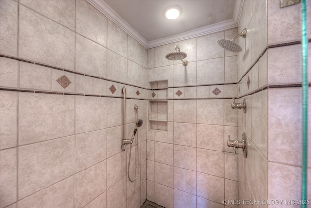 bathroom featuring a tile shower and crown molding