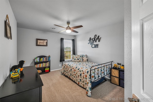 carpeted bedroom with ceiling fan