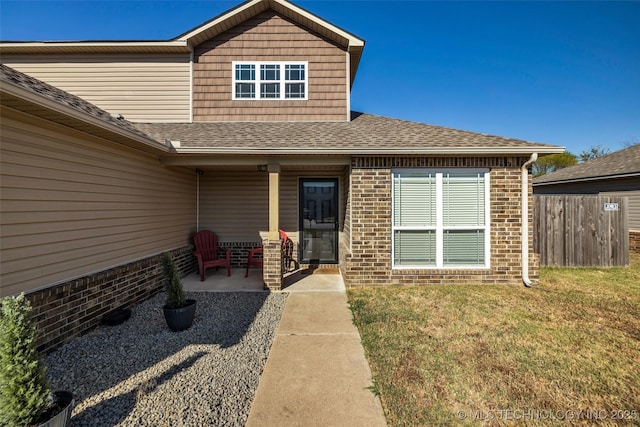 exterior space featuring a lawn and a patio area