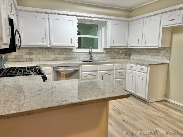 kitchen featuring sink, light stone counters, range with gas stovetop, white cabinets, and stainless steel dishwasher