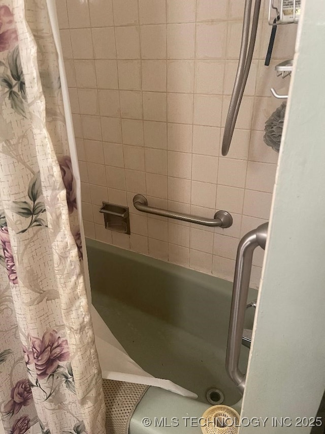 bathroom featuring shower / bath combination with curtain