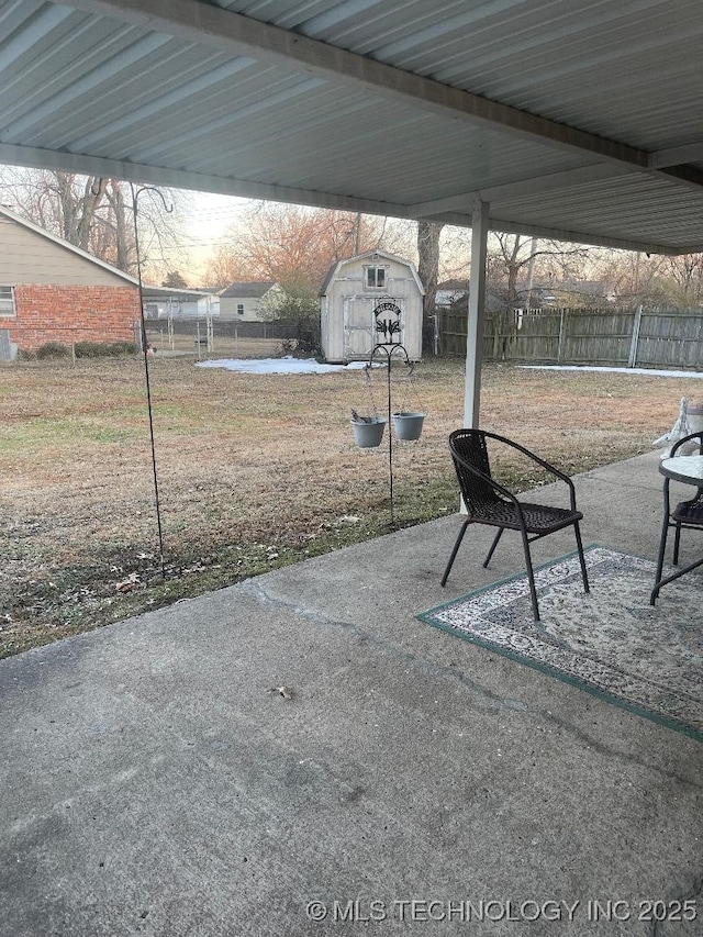 view of patio / terrace featuring a storage unit