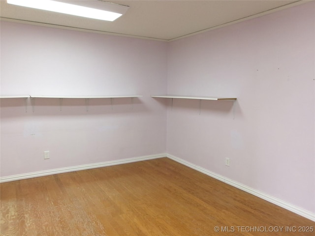 spacious closet with wood finished floors