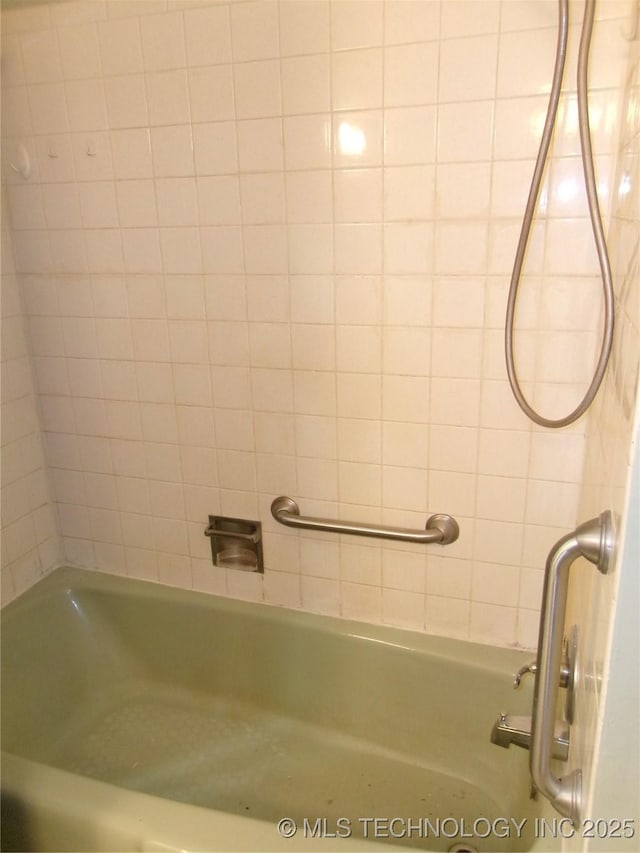 bathroom featuring washtub / shower combination