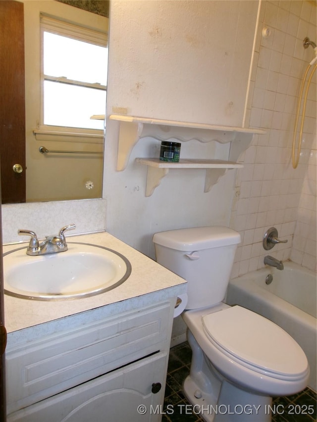 bathroom featuring washtub / shower combination, vanity, and toilet