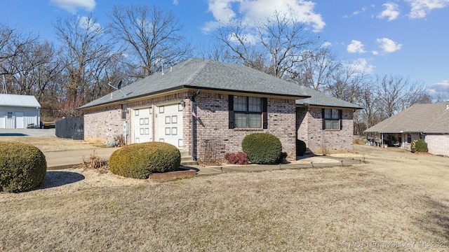 view of side of home featuring a yard