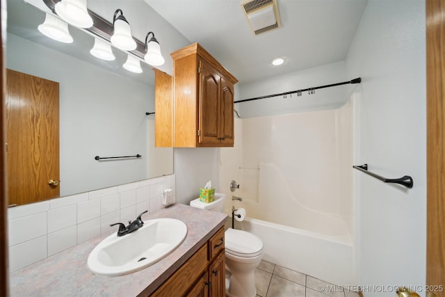 full bathroom with bathtub / shower combination, toilet, vanity, tile patterned flooring, and decorative backsplash