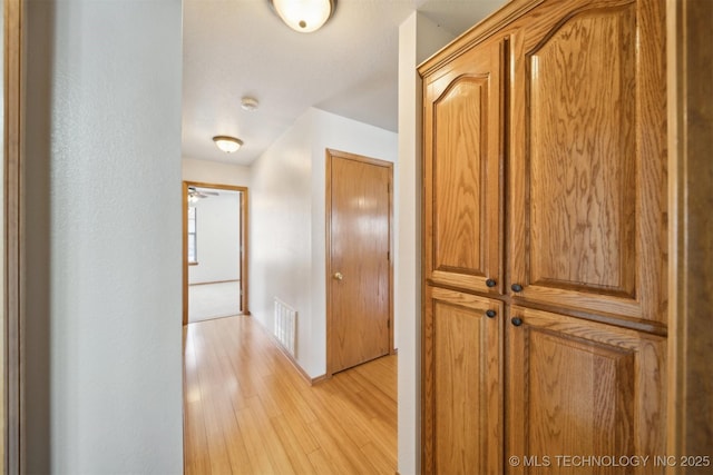 hallway featuring light wood-type flooring