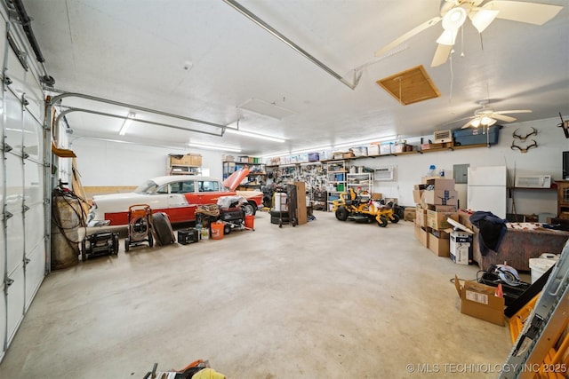 garage featuring ceiling fan and white refrigerator