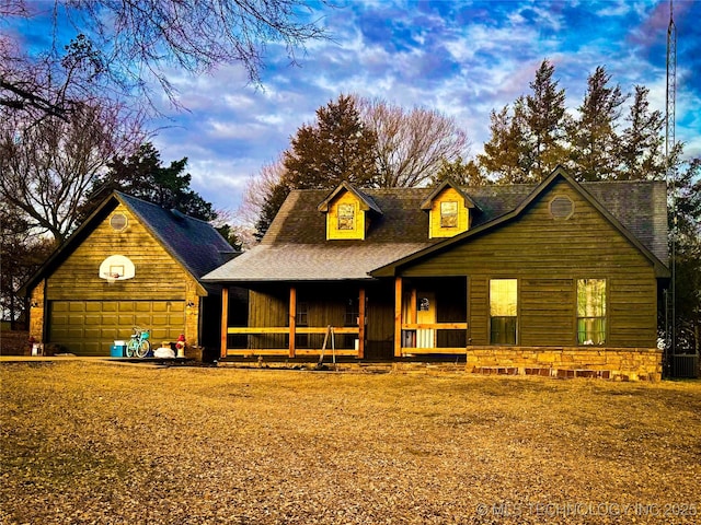 view of front of home featuring a garage and covered porch