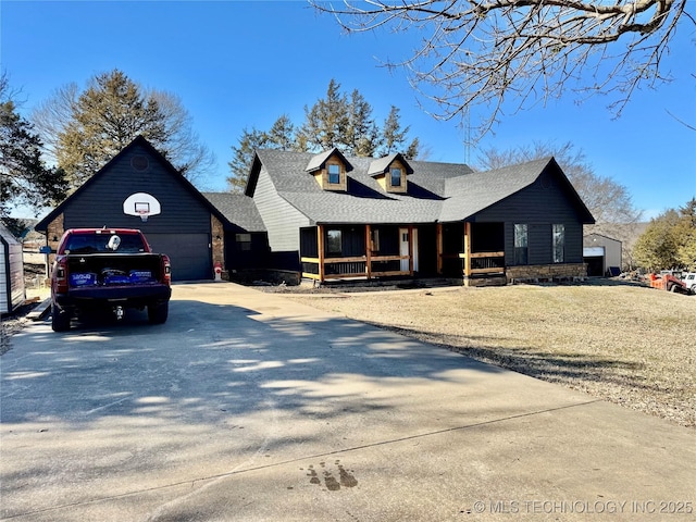 view of front of property featuring a garage and covered porch