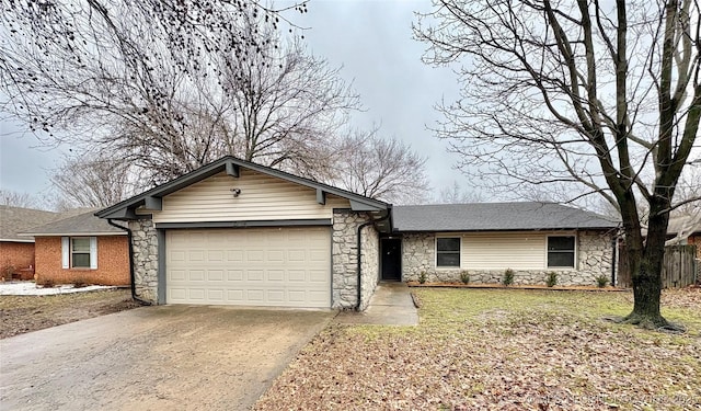 ranch-style house with a garage and a front yard