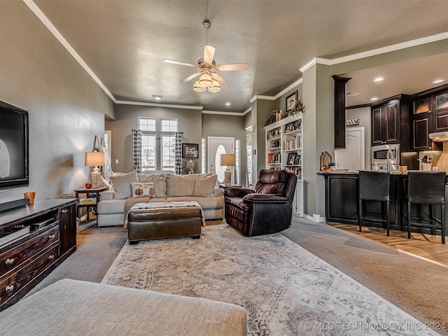 living room with crown molding, carpet flooring, a textured ceiling, and ceiling fan