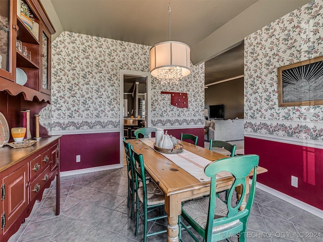 dining area with an inviting chandelier