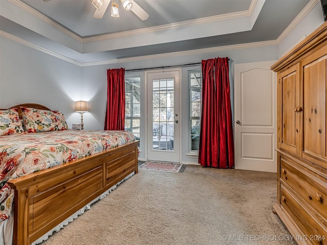 carpeted bedroom with access to exterior, crown molding, a raised ceiling, and ceiling fan