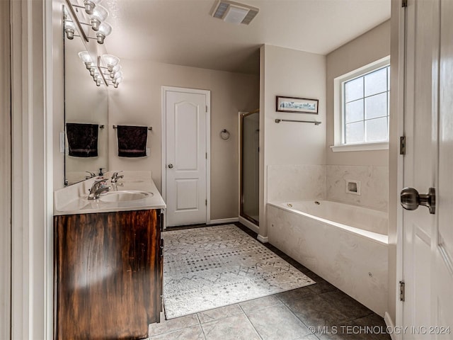 bathroom with vanity, separate shower and tub, and tile patterned floors